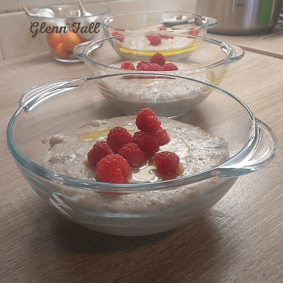 a bowl of homemade porridge with fresh fruit and melted butter